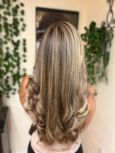 Bride showing lace back of wedding dress and updo