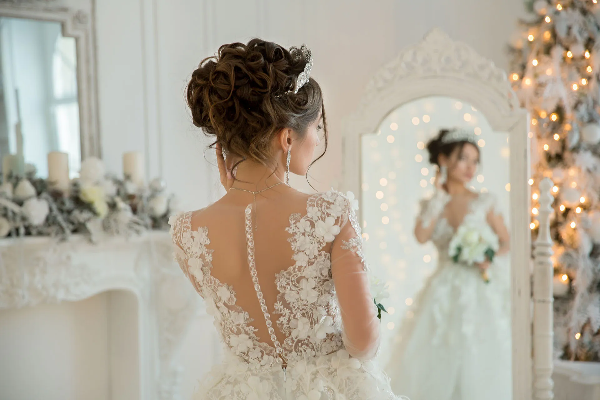 Bride in wedding dress looking in mirror